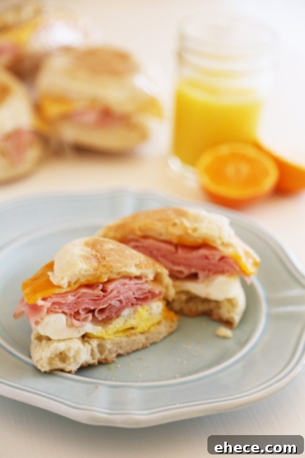 Individually wrapped Homemade Freezer Breakfast Sandwiches ready for freezing.