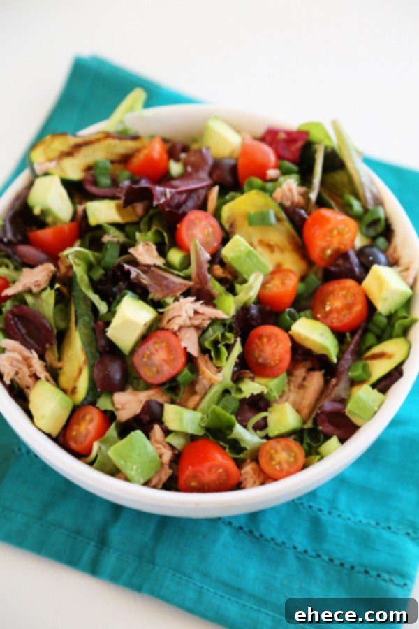 Mediterranean Tuna Salad: Fast, Fresh, Wholesome 4 Assortment of fresh ingredients for Mediterranean tuna salad including ripe tomatoes, briny olives, and vibrant green onion