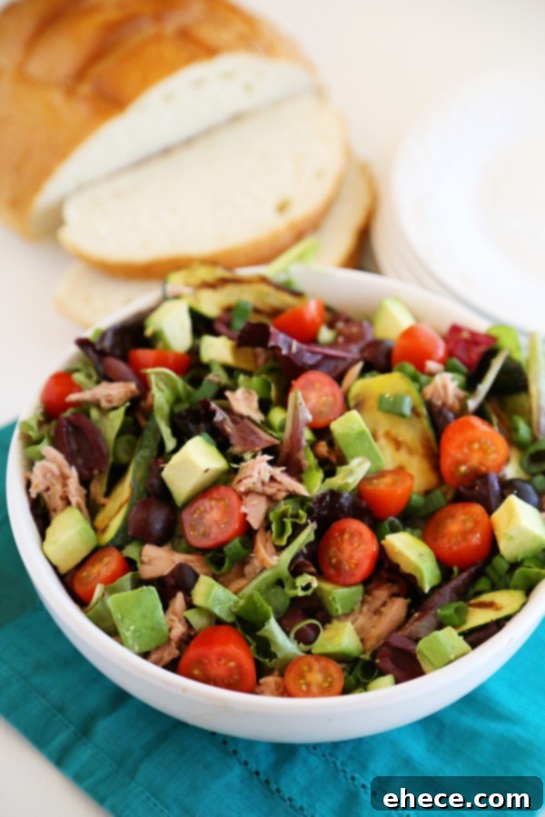 Mediterranean Tuna Salad: Fast, Fresh, Wholesome 6 Close-up view of the vibrant Mediterranean tuna salad, showcasing flakes of tuna, creamy avocado, and fresh greens