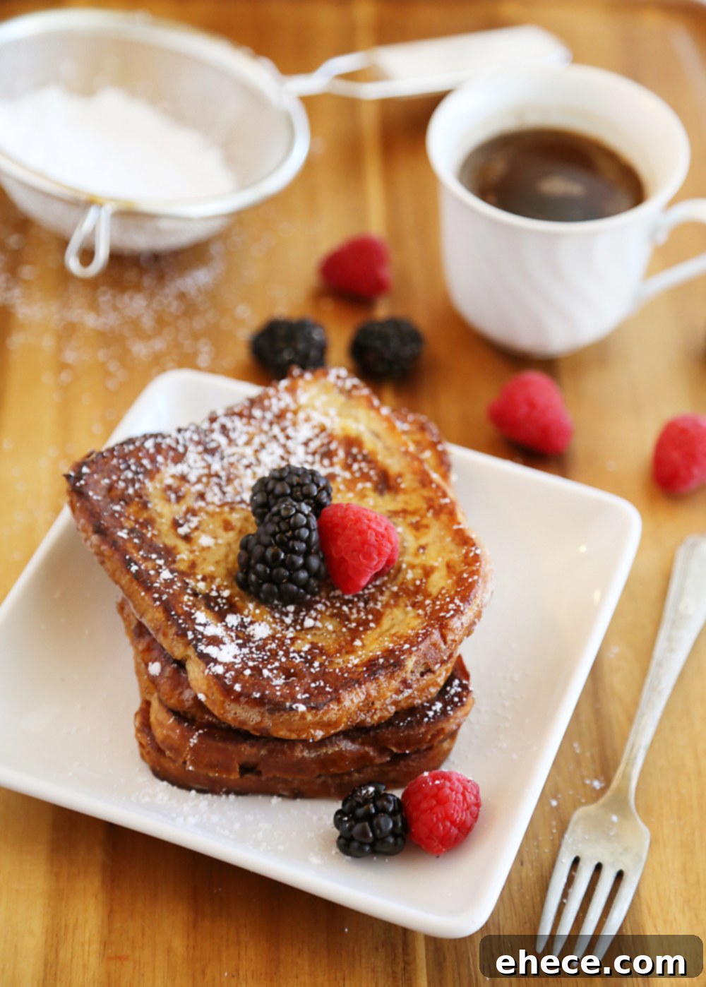 Irresistible Cinnamon Swirl French Toast recipe for an easy, delicious breakfast. Made with just 5 ingredients in 10 minutes. Top with berries and syrup for the ultimate morning treat.