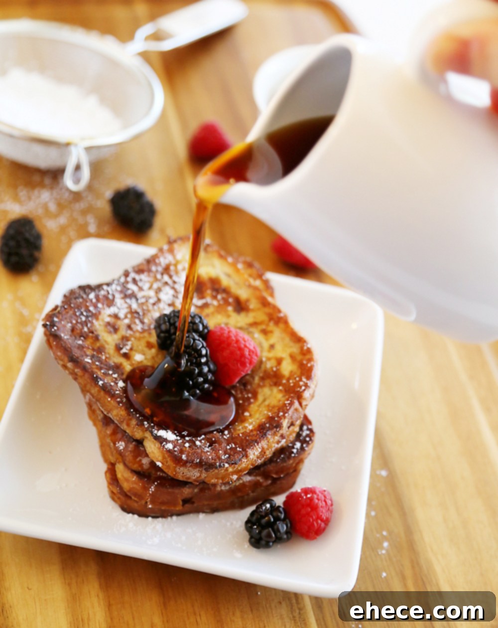 Deliciously simple Cinnamon Swirl French Toast, perfect for a quick breakfast or brunch. Only 5 ingredients and 10 minutes needed. Garnish with fresh fruit.
