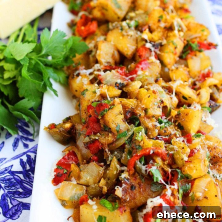 Crispy Potato Hash with Bell Peppers and Onions in a skillet, ready to serve