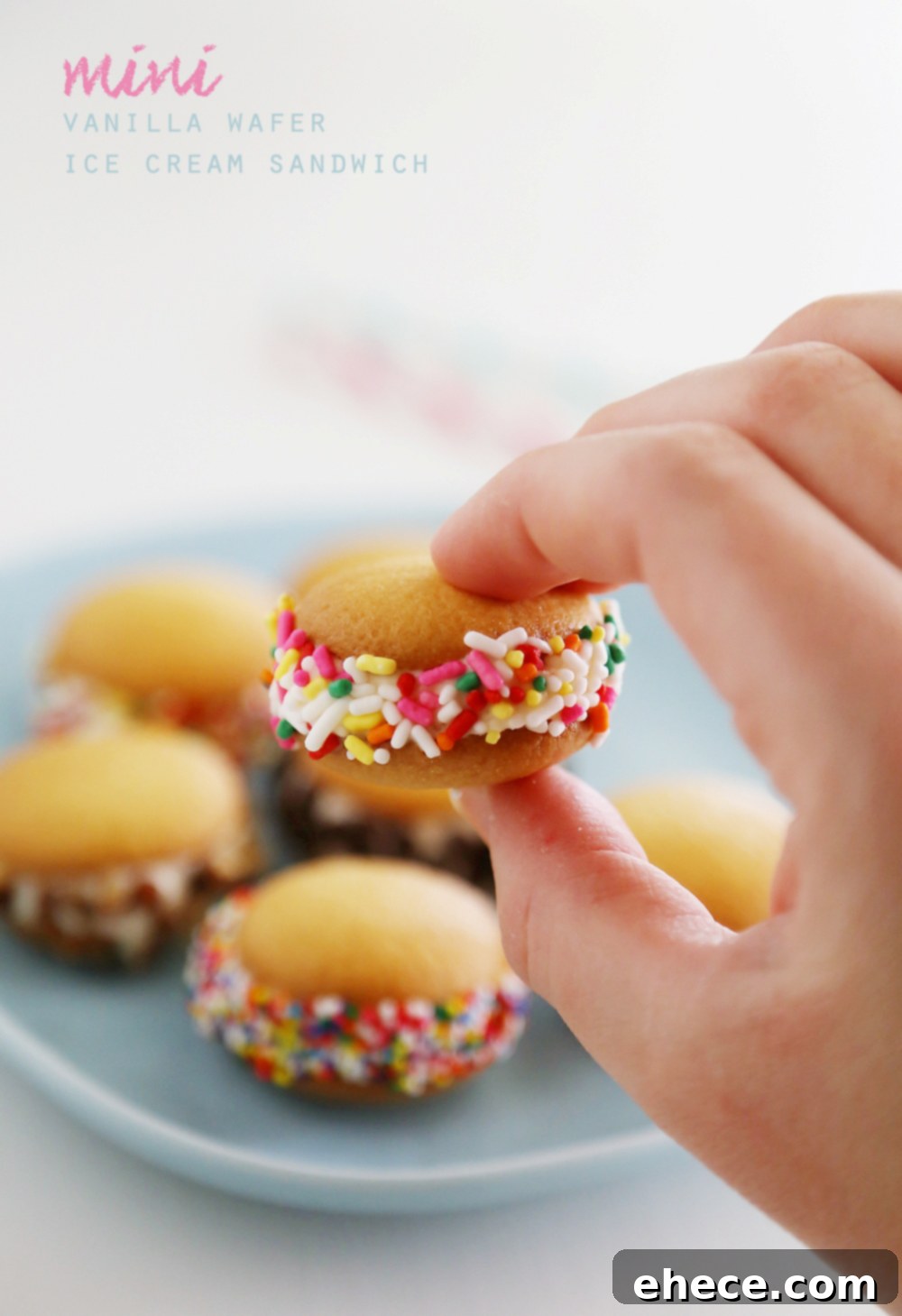 Mini Vanilla Wafer Ice Cream Sandwiches – The perfect quick + easy frozen treat! Roll in your favorite toppings and enjoy. thecomfortofcooking.com