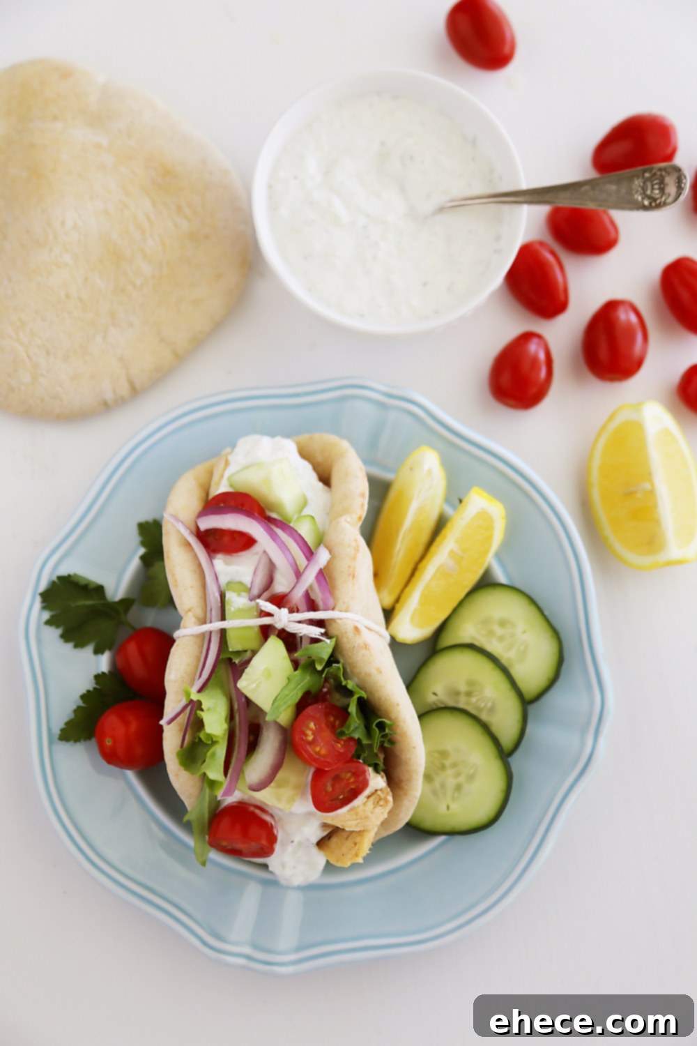 Slow Cooker Chicken Gyros with Tzatziki Sauce - Just like your favorite Greek takeout, but 10x more fresh and flavorful! Thecomfortofcooking.com
