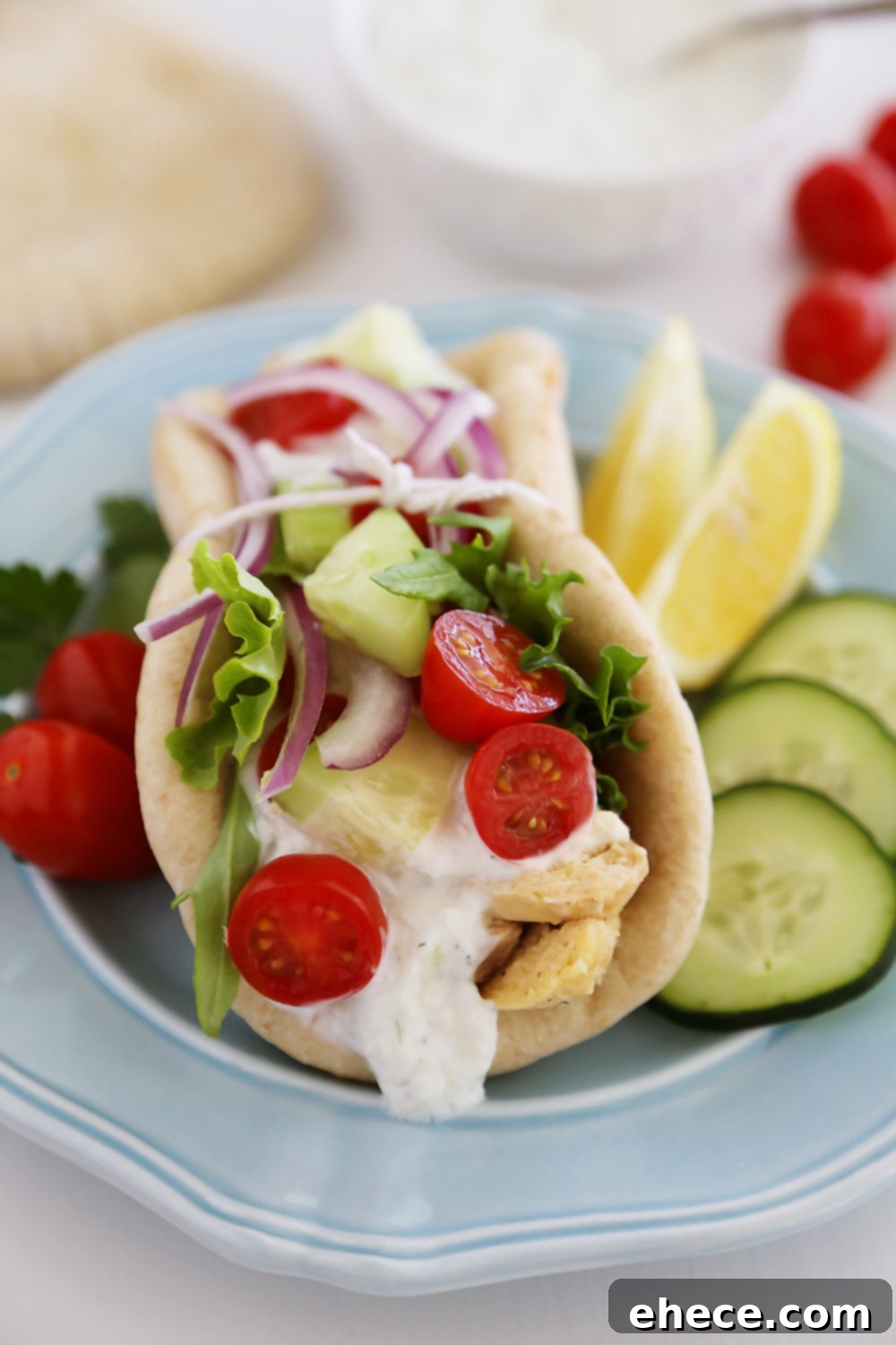 Slow Cooker Chicken Gyros with Tzatziki Sauce - Just like your favorite Greek takeout, but 10x more fresh and flavorful! Thecomfortofcooking.com