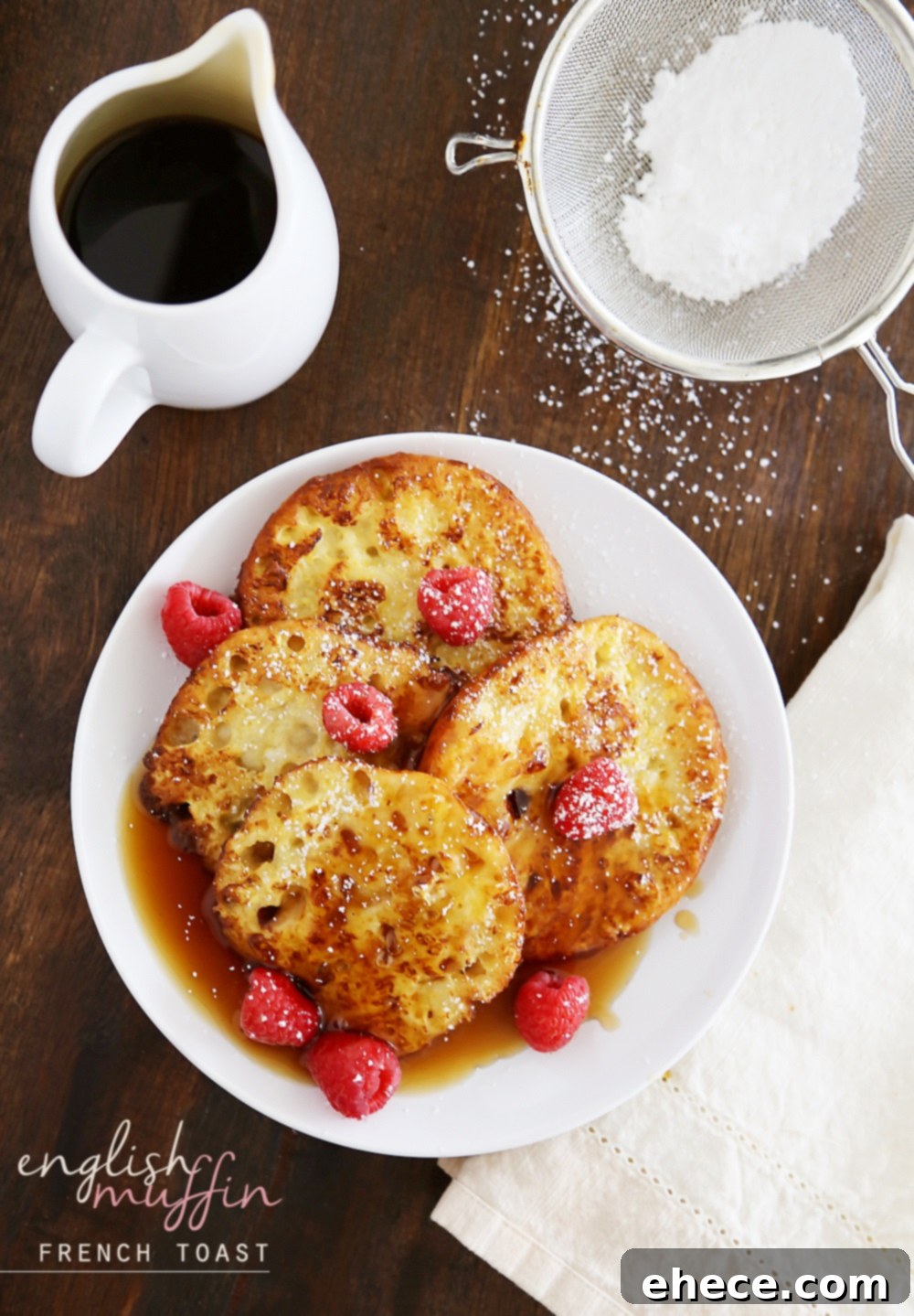 Nook and Cranny French Toast 5 English Muffin French Toast on a plate with berries and syrup, ready to be served.