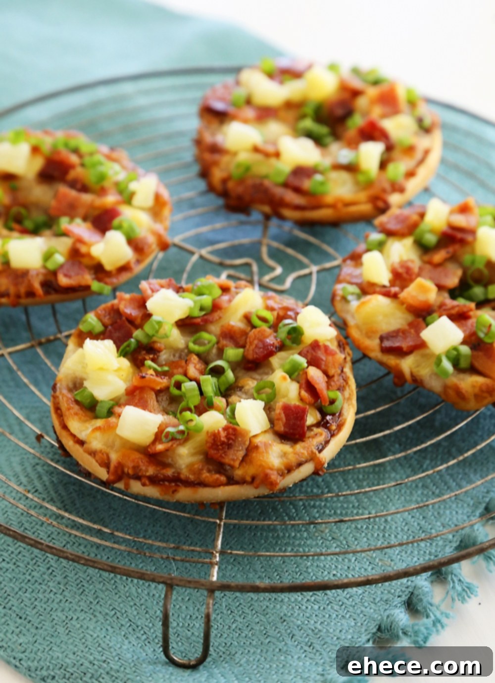 Crispy BBQ Bacon Hawaiian Bagel Thin Pizzas with bacon, barbecue sauce, and fresh pineapple