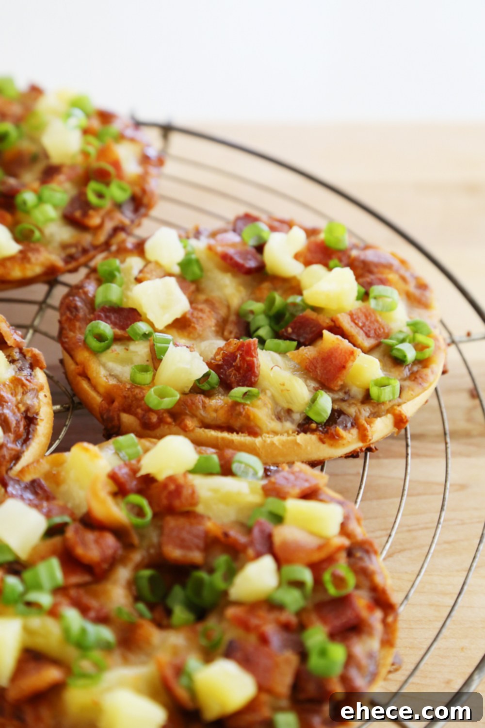Close-up of a crispy BBQ Bacon Hawaiian Bagel Thin Pizza
