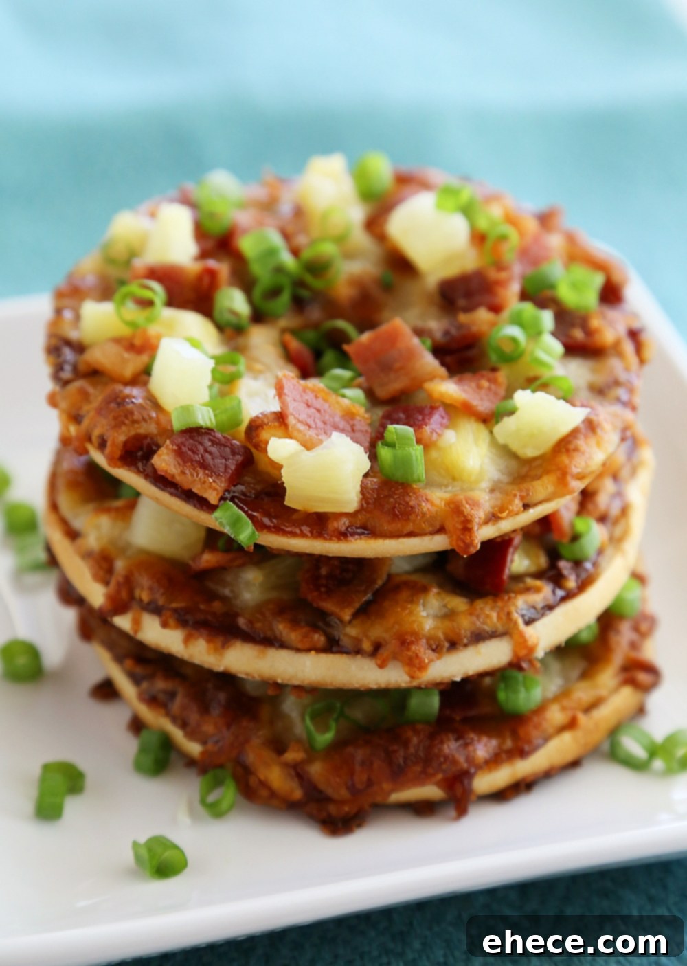 Stack of BBQ Bacon Hawaiian Bagel Thin Pizzas ready to serve