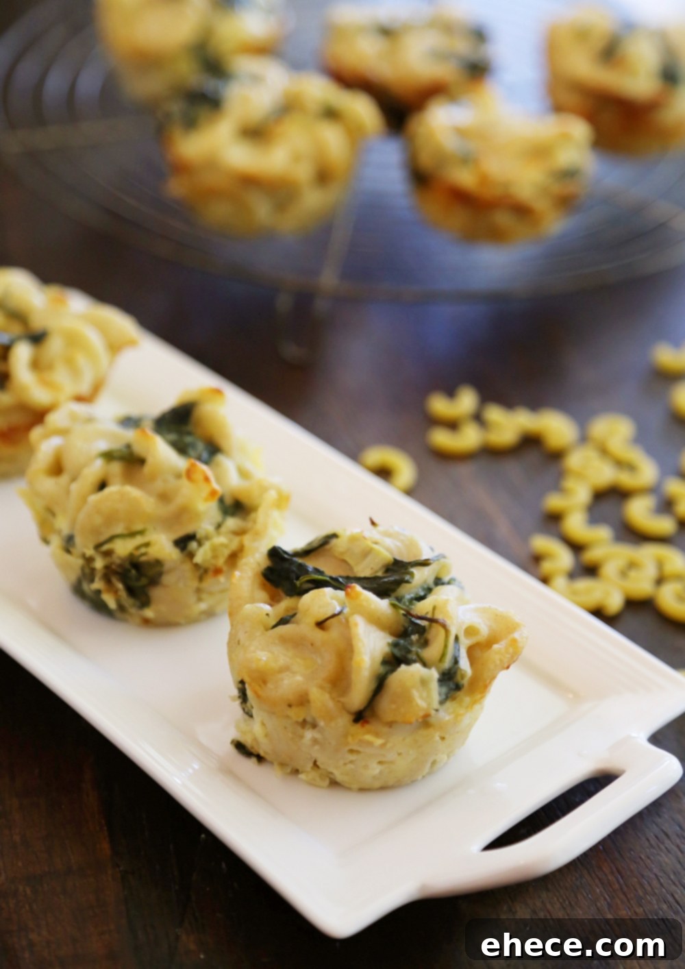 Creamy Spinach Artichoke Mac and Cheese Bites 6 Another perspective of the Spinach and Artichoke Macaroni and Cheese Bites, highlighting their appealing texture and golden-brown tops.