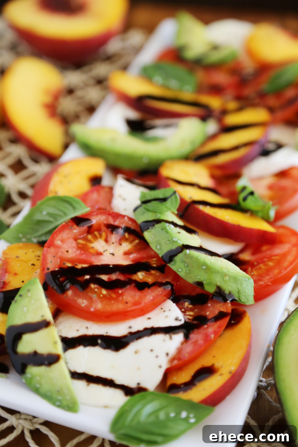 Sun-Kissed Peach and Avocado Caprese 3 Close-up of fresh Peach and Avocado Caprese Salad, highlighting vibrant colors and textures. Thecomfortofcooking.com