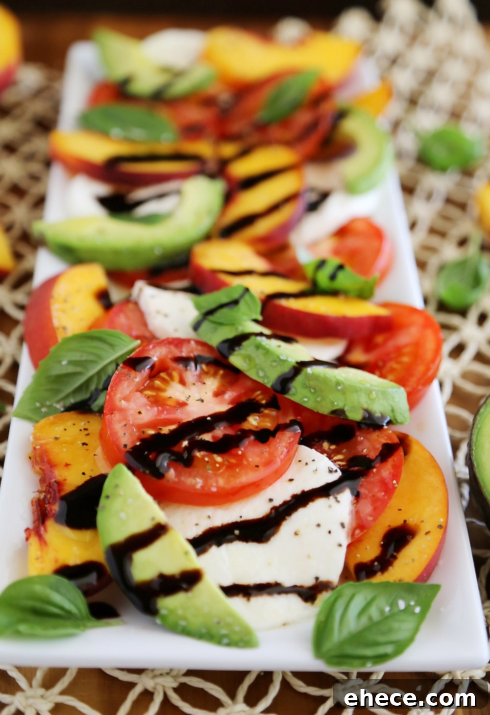 Sun-Kissed Peach and Avocado Caprese 5 Beautifully plated Peach and Avocado Caprese Salad with vibrant ingredients. Thecomfortofcooking.com