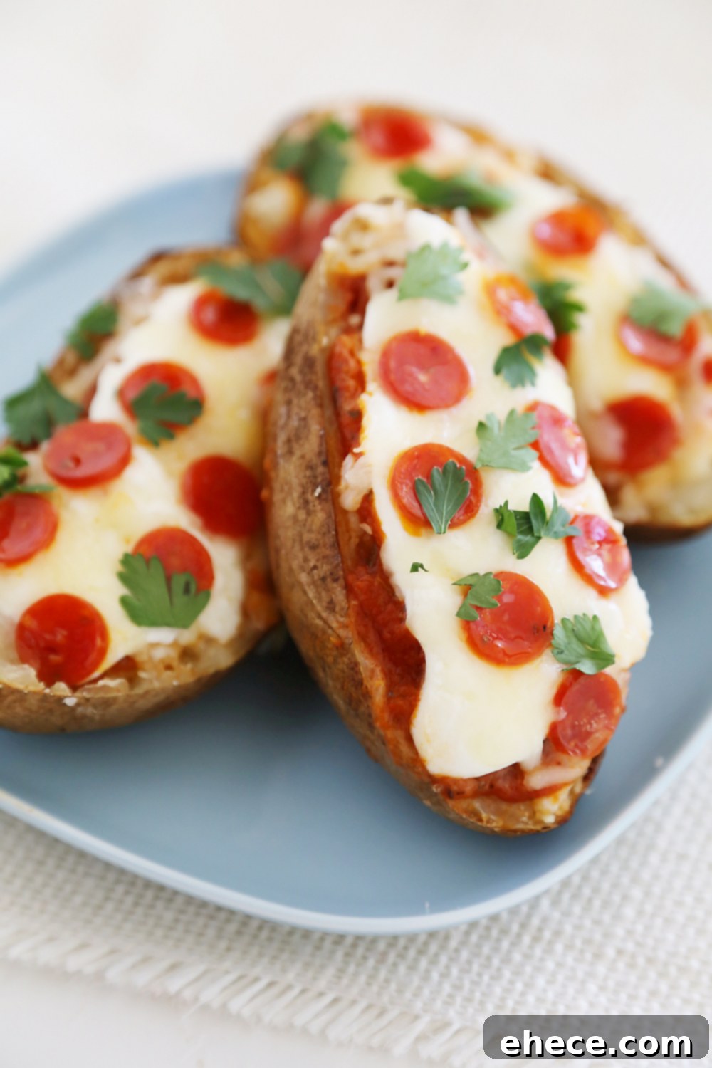 Ultimate Pizza Potato Boats 2 Pepperoni Pizza Potato Skins - Hearty, crispy potato skins meet cheesy pepperoni pizza! A perfect party appetizer. Thecomfortofcooking.com