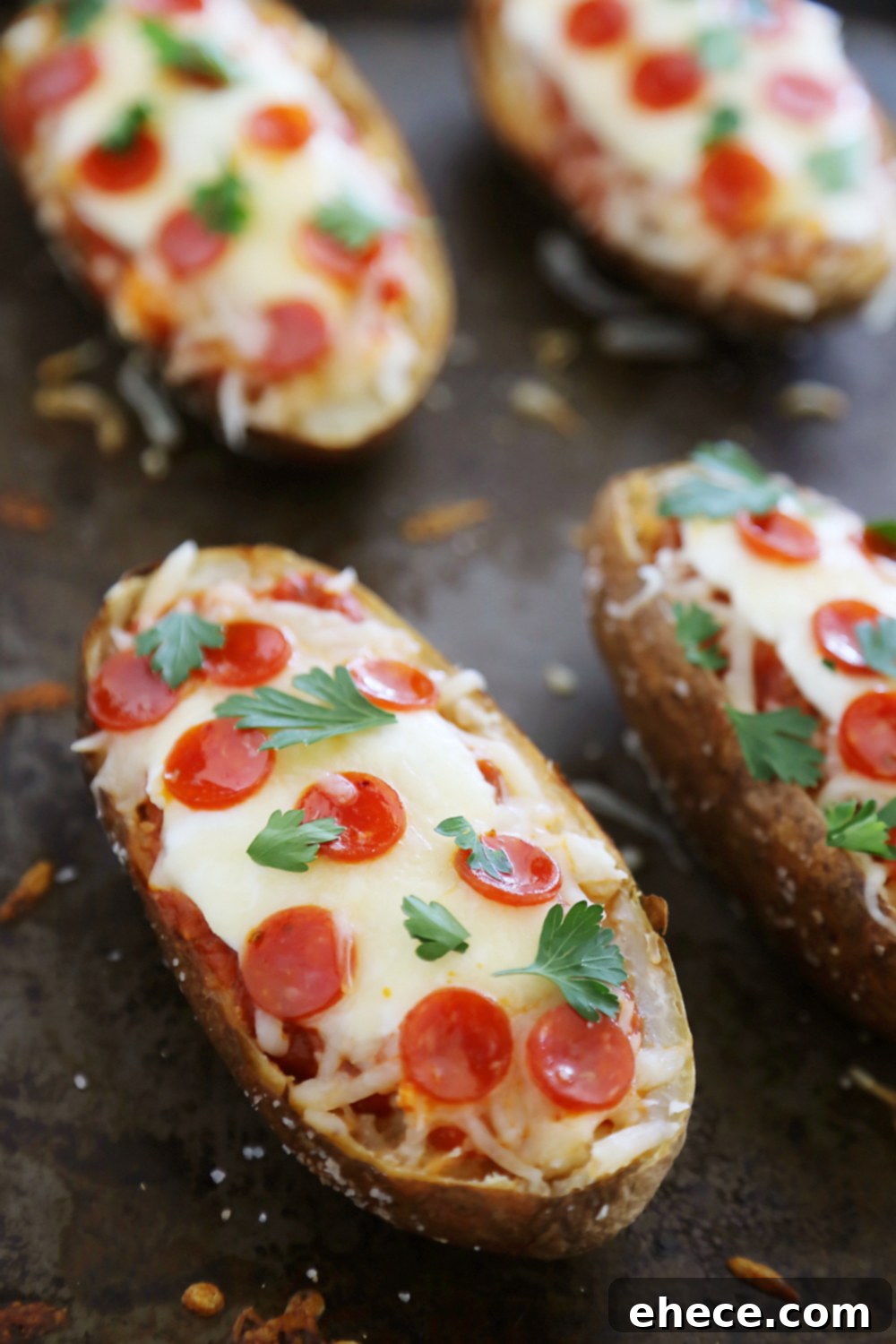 Ultimate Pizza Potato Boats 4 Pepperoni Pizza Potato Skins - Hearty, crispy potato skins meet cheesy pepperoni pizza! A perfect party appetizer. Thecomfortofcooking.com