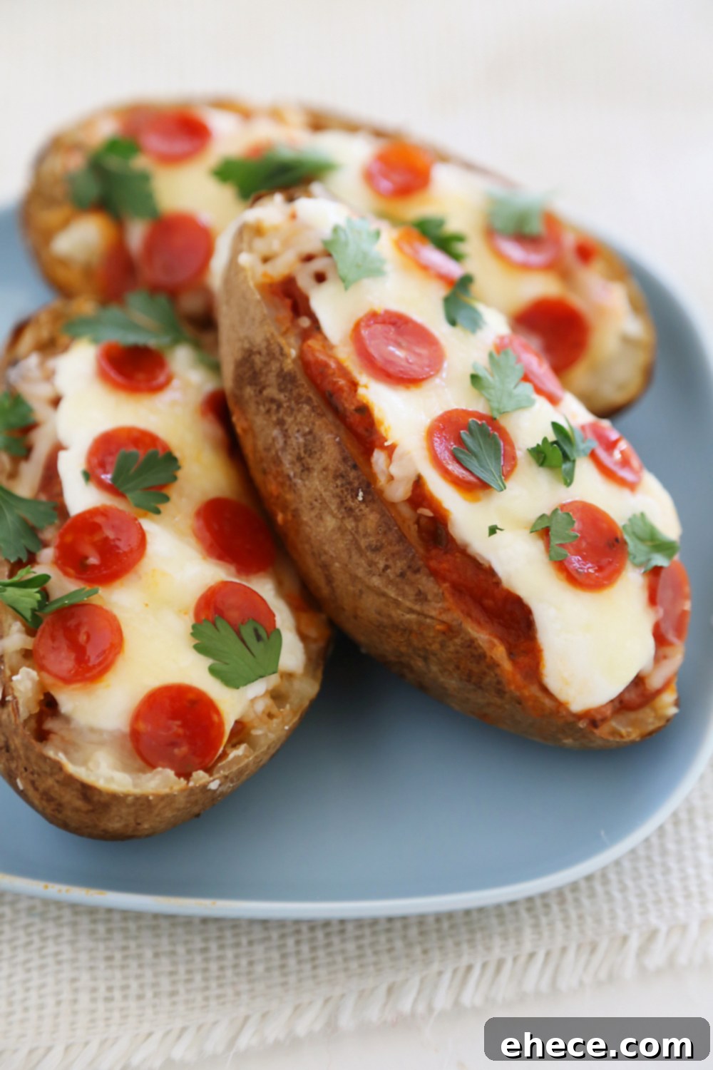 Ultimate Pizza Potato Boats 5 Pepperoni Pizza Potato Skins - Hearty, crispy potato skins meet cheesy pepperoni pizza! A perfect party appetizer. Thecomfortofcooking.com