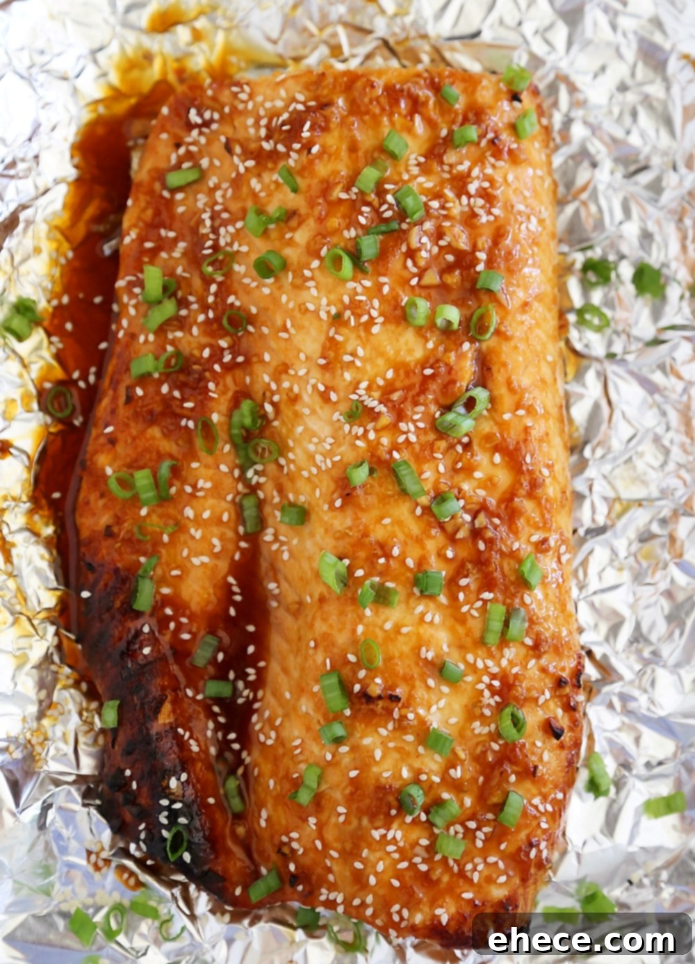 Honey-Soy Asian Salmon in Foil - Close-up of delicious salmon with a sticky, caramelized crust.