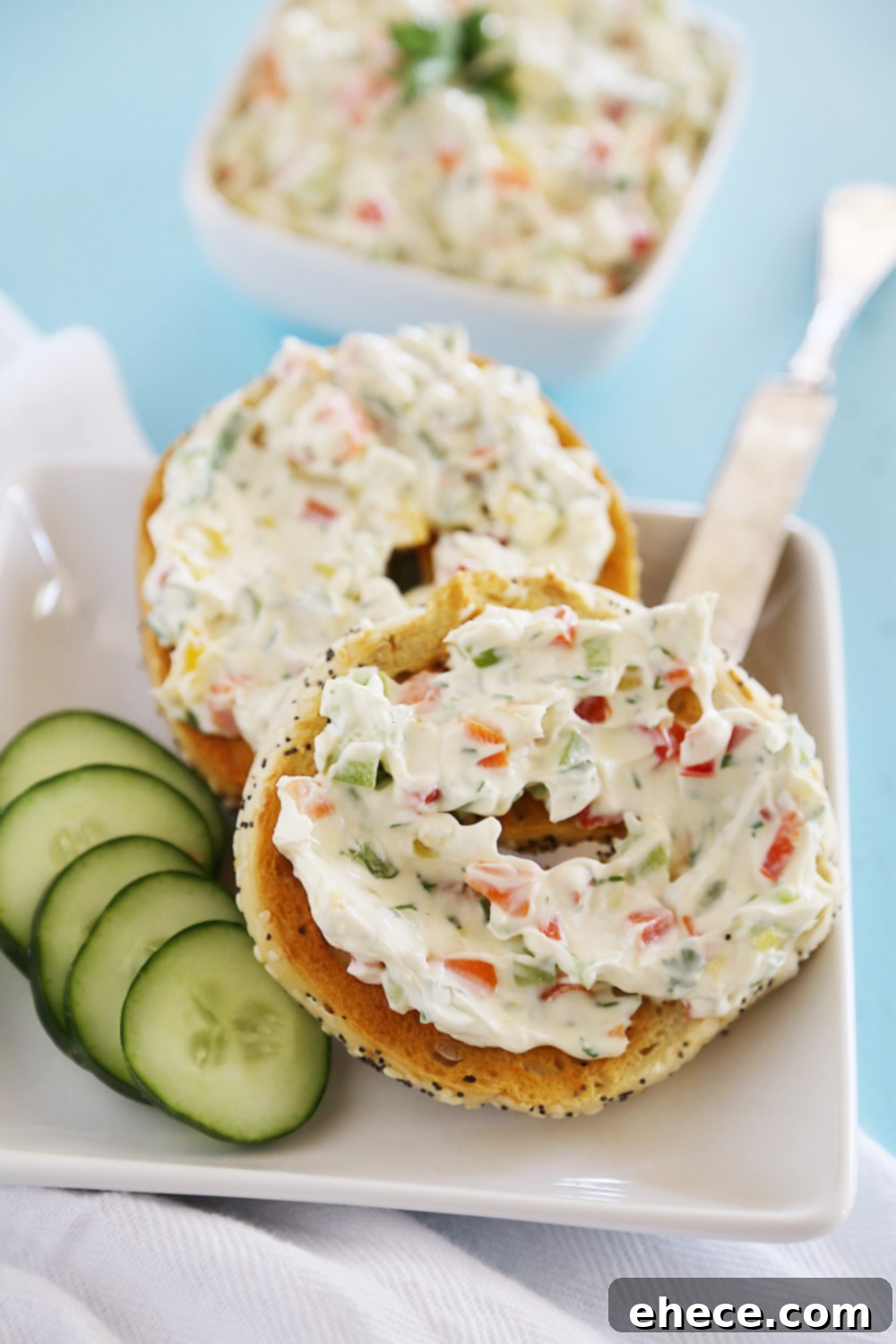 Whipped Garlic Veggie Cream Cheese – So easy and versatile! Spread on toasted bagels, or mix in to pasta sauce for decadent creaminess. Thecomfortofcooking.com